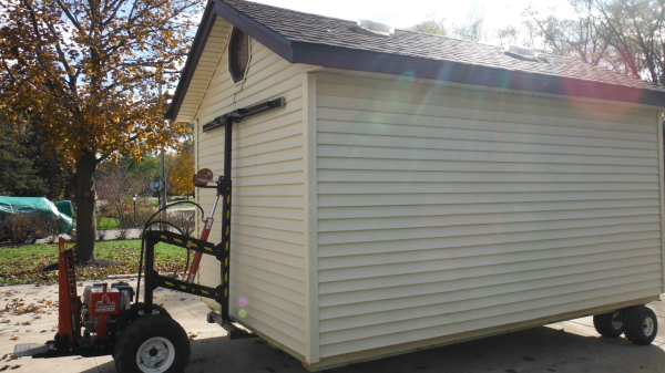 Shed moving and delivery with a shed mule hydraulic lift